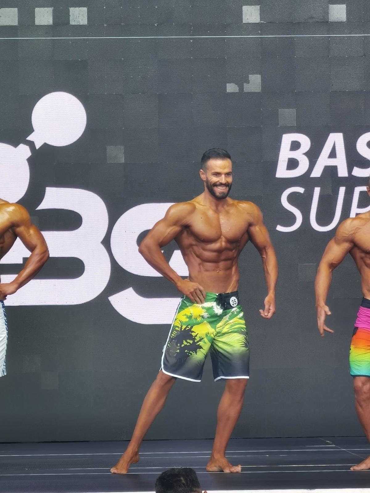 Competition stage physique presentation at bodybuilding event
